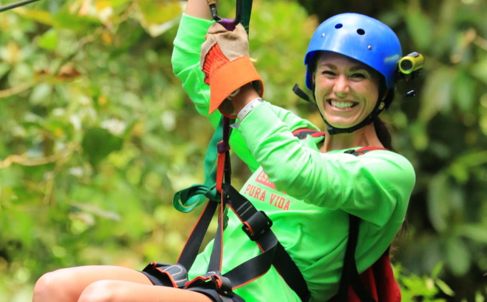 A girl in cloud forest zip line in Monteverde Costa Rica