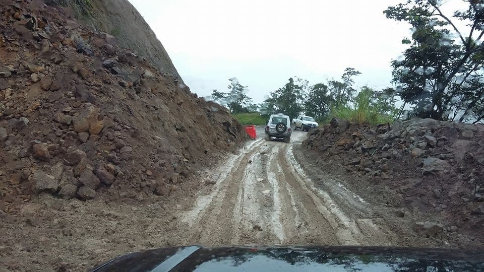 a car parked on the side of a mountain