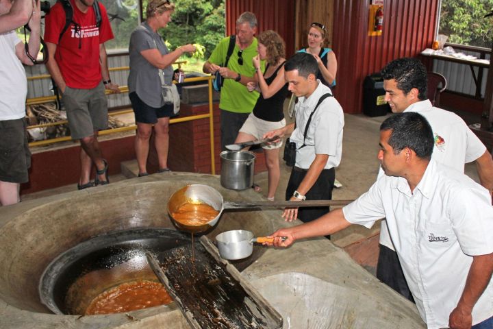 a group of people producing sugar at El Trapiche Tour