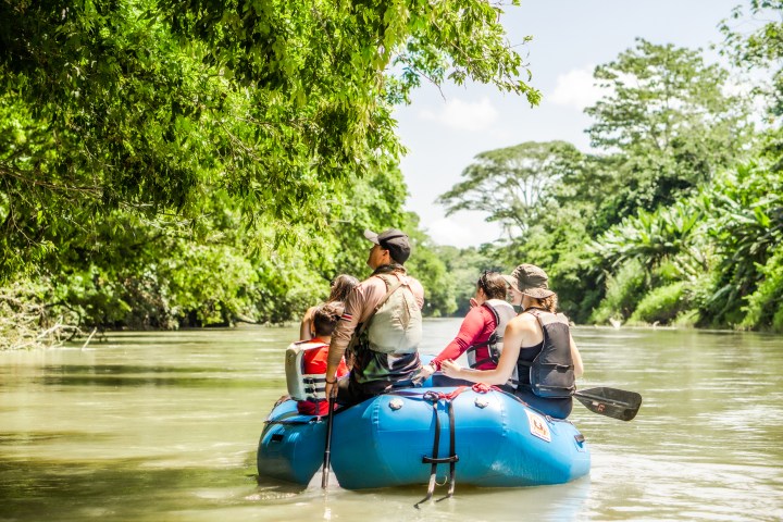 Small boat in Peñas Blancas River, Costa Rica